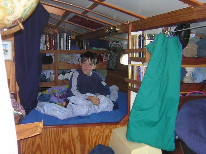 Nicolas hanging in Debbie & Mike's berth. Undoubtedly music with a good beat is playing for him.