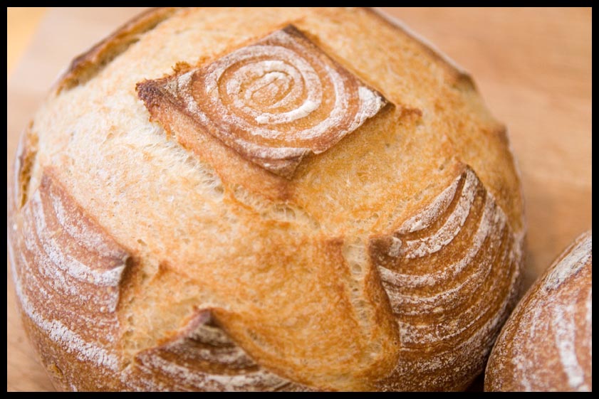 Woman with a Hatchet Baking Sourdough Bread