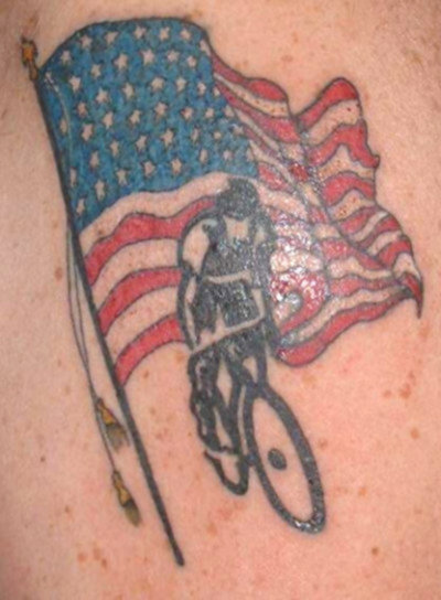 American flag with bike rider tattoo.