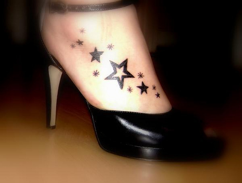 quarter sleeves tattoo henna foot tattoo. Stars lower back tattoo.
