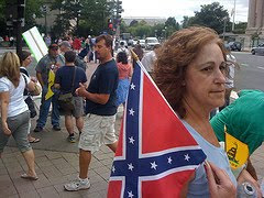 teabaggers at protest, one with confederate flag
