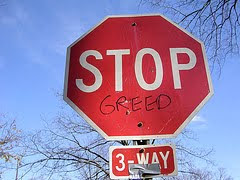 stop sign modified to say stop greed