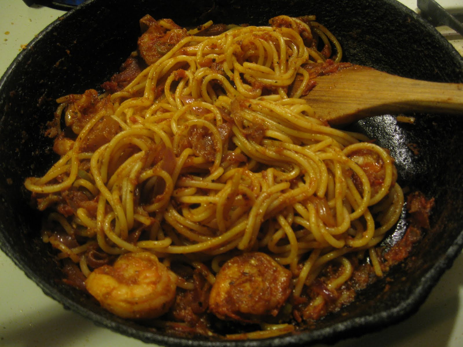 A delicious plate of pasta tossed in a rich prawn and tomato sauce