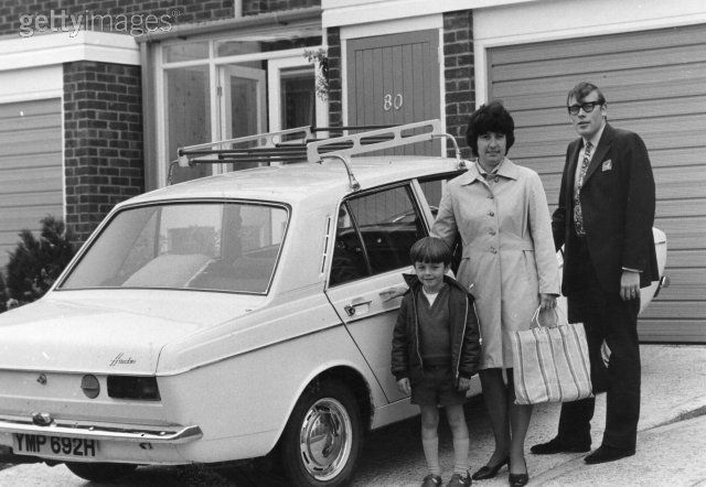  son Michael in the driveway of their home by their Hillman Hunter 1974