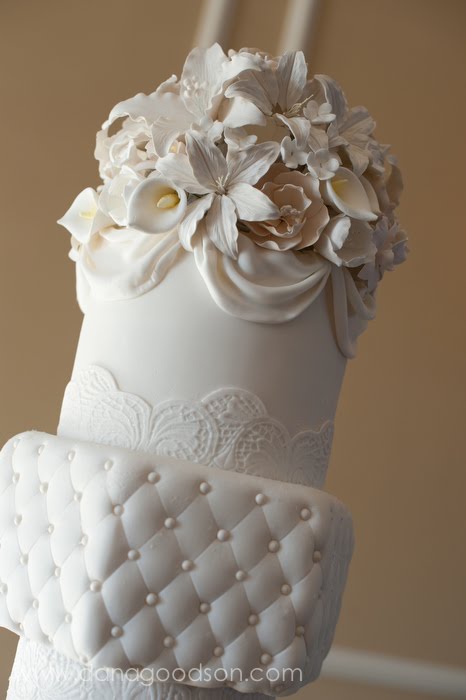 The cake topper was a dome of white and ivory gum paste flowers and the top