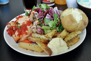 Plate with Baked potatoe, veggie salad, Chicken Breast, Ajvar