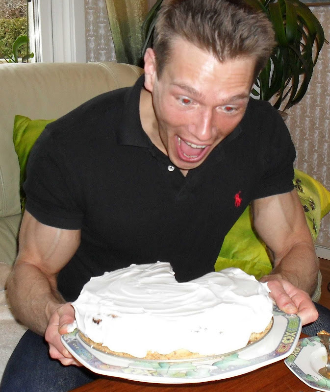 Martin happily admiring a whole cheesecake
