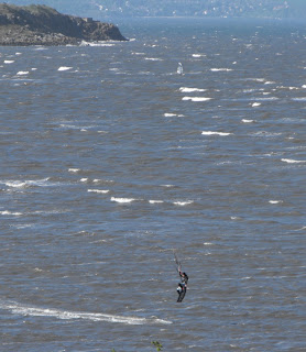 Kite-surfer lifted into the air