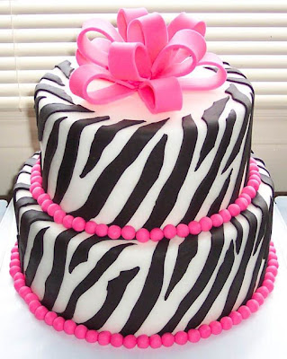 pink zebra wedding cake with ribbon