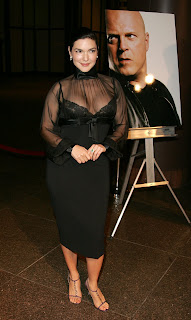 Ladies in Satin Blouses: Laura Harring - black see-thru satin turtleneck