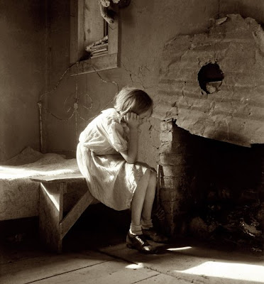 One of my favorite pictures by Dorothea Lange is of a girl sitting near a 