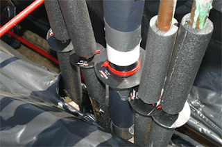 An example of termite-proofing, once the concrete is poured around them, these collars will prevent termites from entering the building through the foam insulating sleeves surrounding copper and PVC plumbing pipes