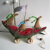 Northfieldprimitives makes these quirky toys on wheels.