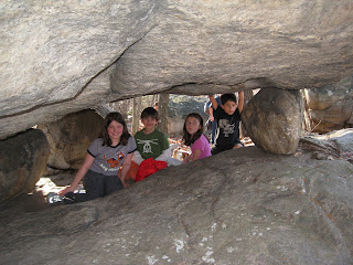 Kids under Tripod Rock