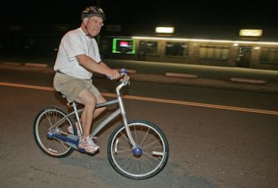 Image of Boston Mayor Thomas Menino riding a bicycle