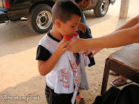 a little boy receives a shirt