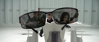 Chris Redfield (Wentworth Miller) and Claire Redfield (Ali Larter) reflect in Chairman Wesker’s (Shawn Roberts) sunglasses