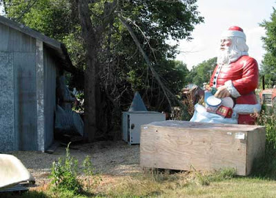 Figure of Santa surrounded by grass
