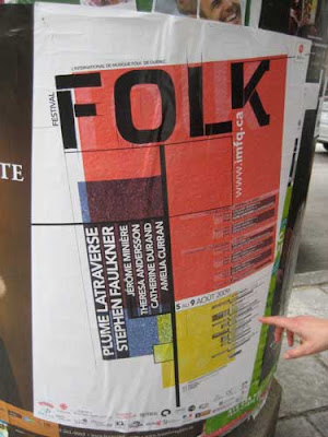 Large poster with the word FOLK at the top and Mondrian-style red, yellow and blue blocks with black lines below 
