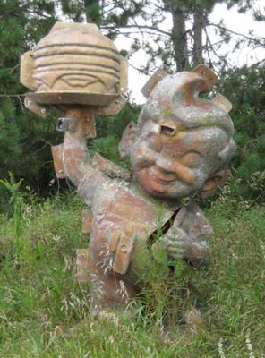 A mold for the Big Boy restaurant figure, surrounded by grass