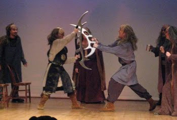 Theatrical Klingons battling on stage