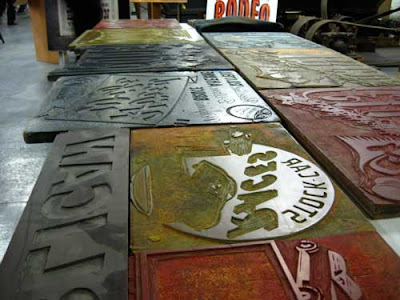 Angle shot of a table full of illustration plates in a range of colors