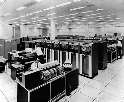Black and white photo of a room-filling mainframe computer