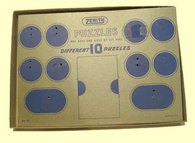 Gray cardboard with blue ink circles with holes showing where the puzzles were attached