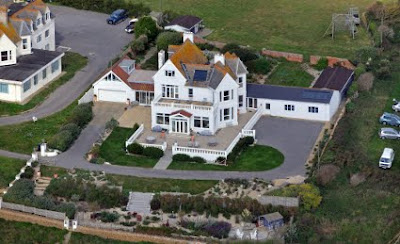 Large white house photographed from the air