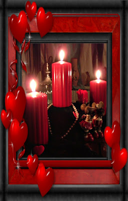 Three large pillar candles on black lace with pearls and hearts