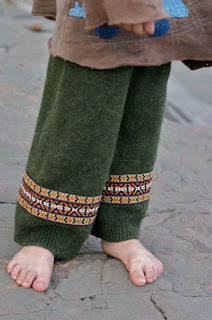 Image of green upcycled longies made from a wool sweater and vintage trim