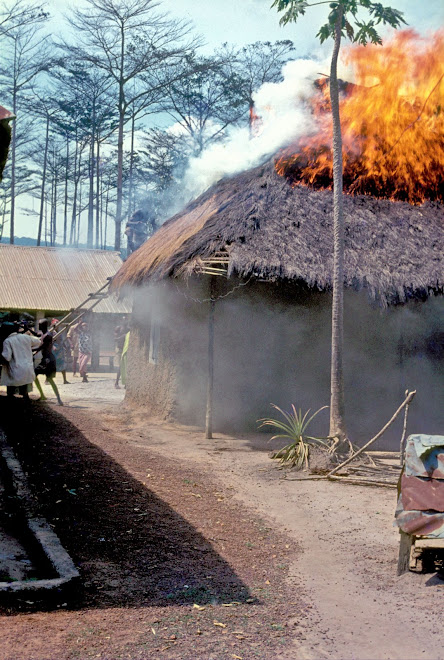 thatch roof fire in village on road to Panguma