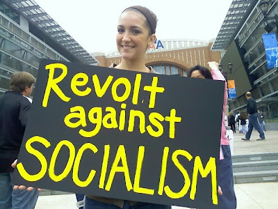 Dumbass! So-called socialism IS the revolution, the revolution against the wealthiest anti-taxers who would starve this nation even as they drain its lifeblood for their own profit.  You know what's really sad - this dimwit's from Dallas, where the parasitic aspect of the Rich is more than obvious.