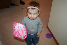 Uh oh! Pink headband and flower bag! And is that a necklace?