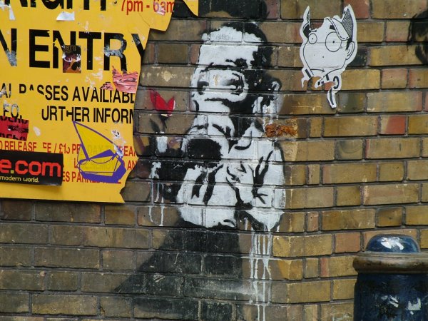 [Banksy,+at+Brick+Lane,+East+End+(of+London),+2004.jpg]