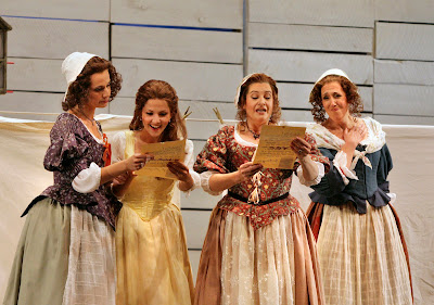(L to R) Kelley O'Connor (Meg Page), Laura Giordano (Nannetta), Claire Rutter (Alice Ford), and Nancy Maultsby (Quickly) in Act I, scene 2 of Falstaff, costumes by Clare Mitchell, Santa Fe Opera, 2008 (photo © Ken Howard)