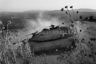 Israeli tanks crossing the border with Lebanon during the Israel Hezbollah war, Aug 2006. Copyright © Greg Funnell 2007. All rights reserved.