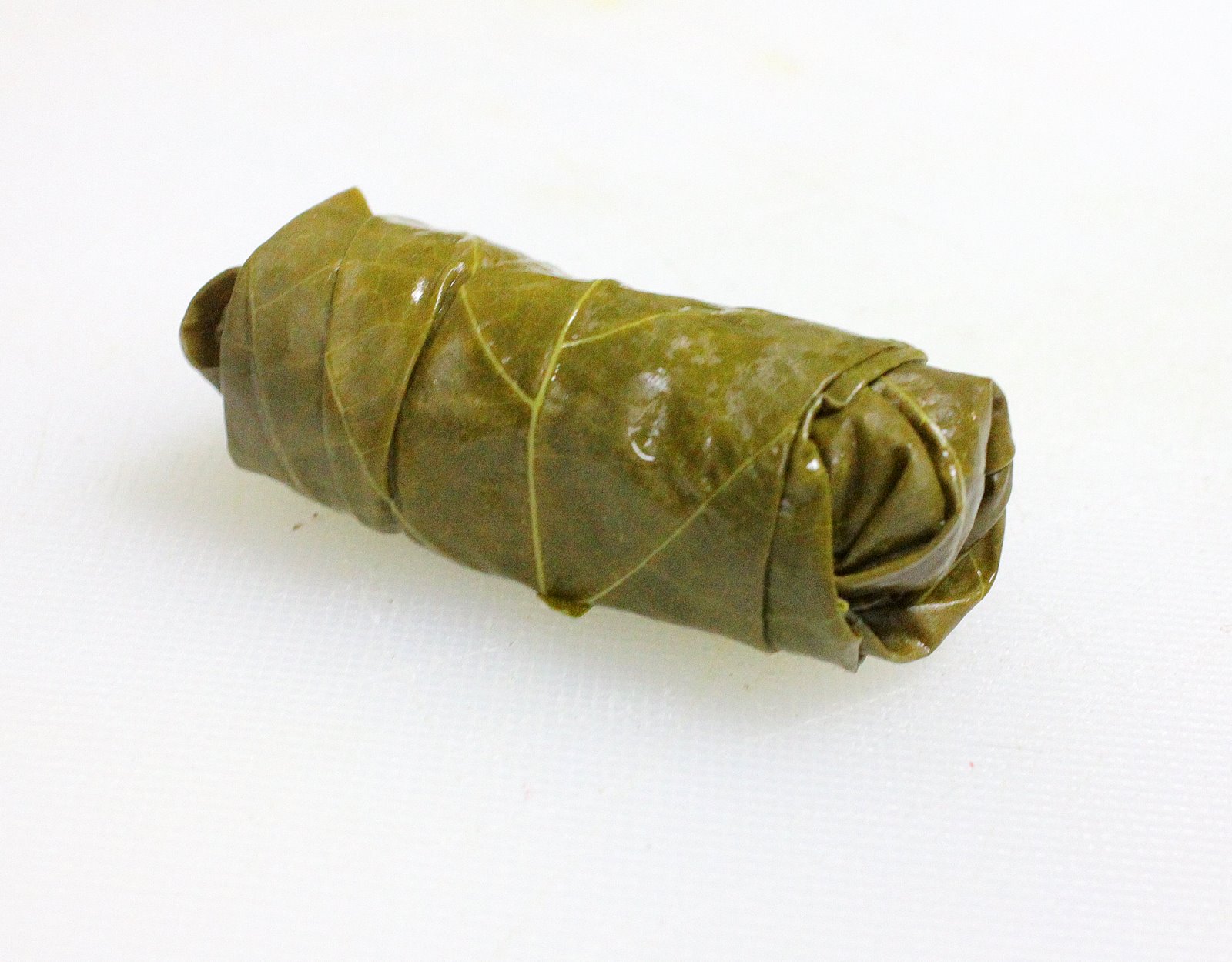 Cooking the Globe Koupepia (Stuffed Grape Leaves)