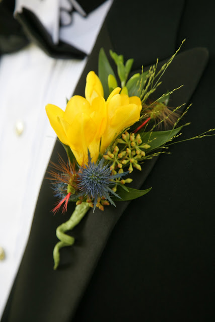 Boutonniere created by Belle Fiori includes fly fishing lures