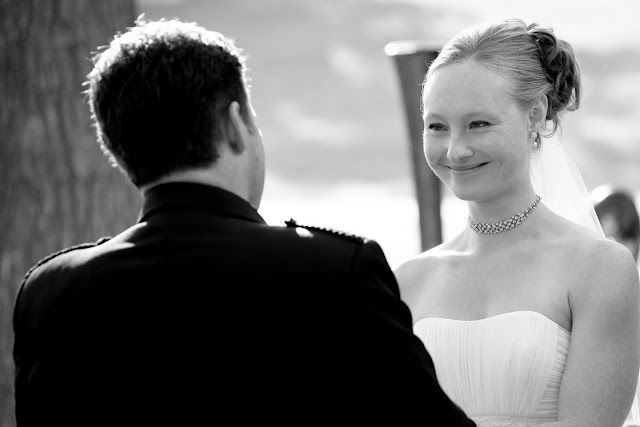 Bride smiling at groom as they exchange wedding vows