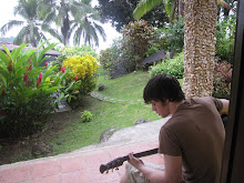 Josh playing his guitar in Portobello