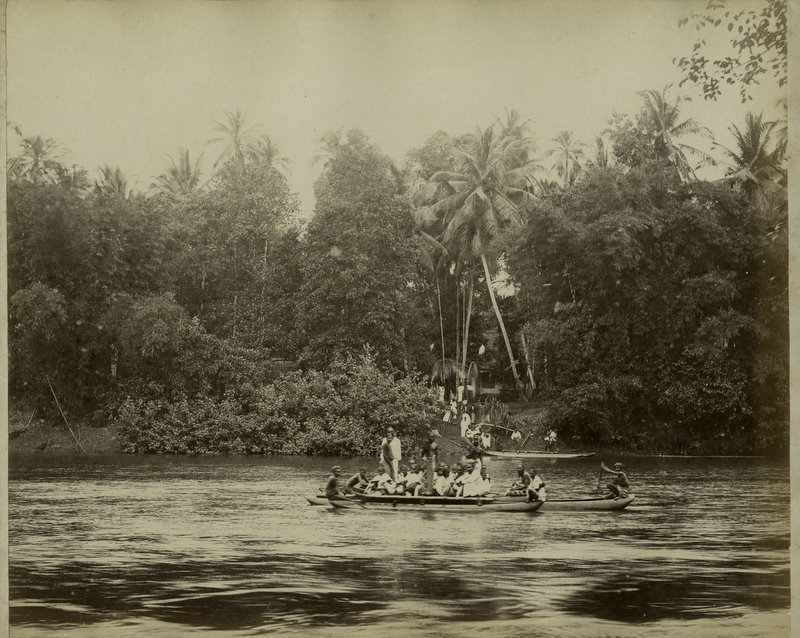  People in Canoes on River