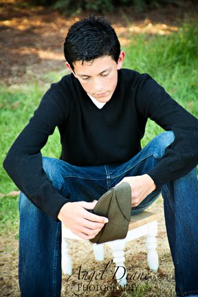 Son Holding Dad's Hat