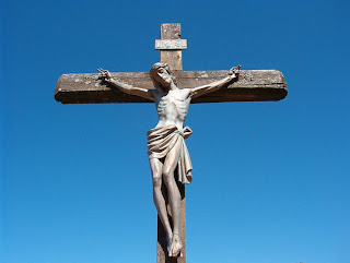 Jesus hanging on the wooden Cross with sky background photos for powerpoint(ppt) for Christian download for free