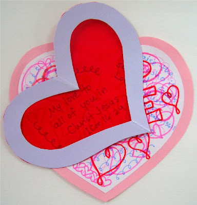 Scribbled valentine with plastic heart decoder