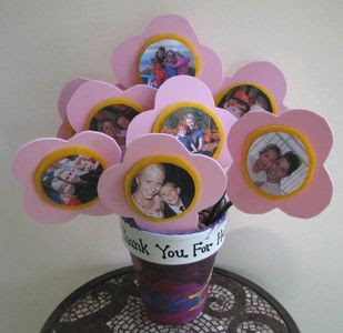 Foam flowers in a pot with family pictures in center