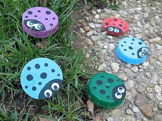 Jar lids painted as multiple colors of ladybug