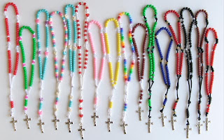 Multicolored lineup of rosaries