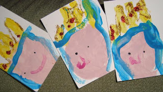 Small cards of painted handprint Mary faces