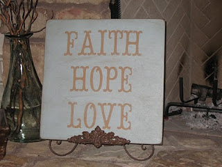 Sign reading "Faith, Hope, Love"